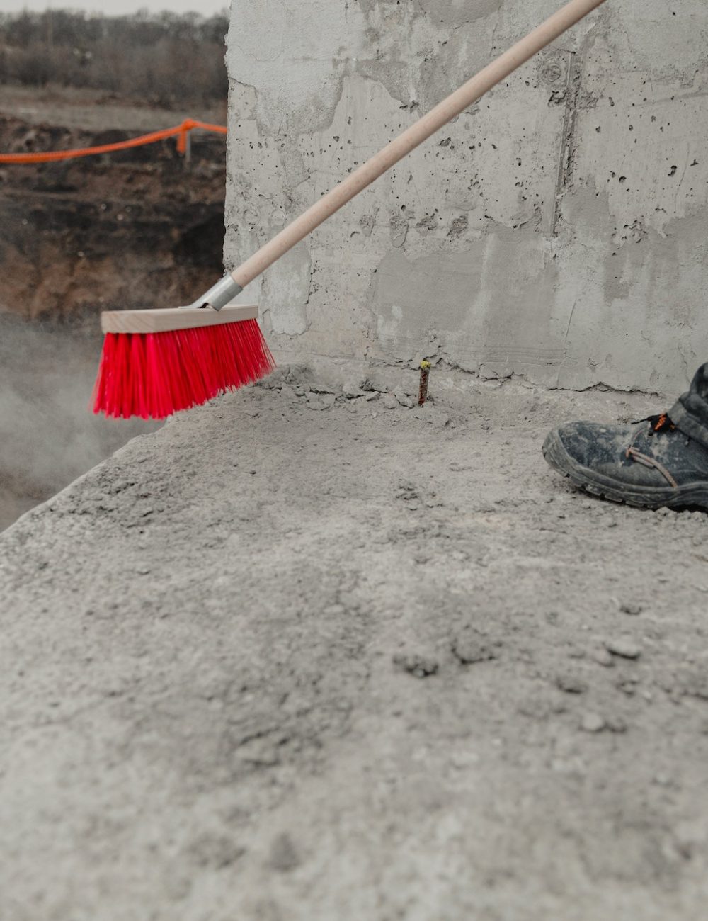 Closeup shot of a cleaning brush being used at the construction process